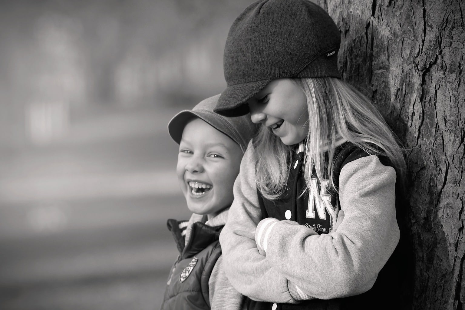 Photograph of two brothers laughing in a park