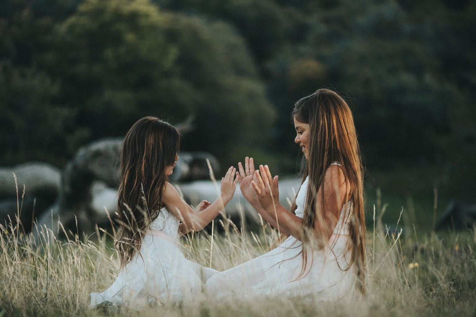 Photo of two girls playing in nature