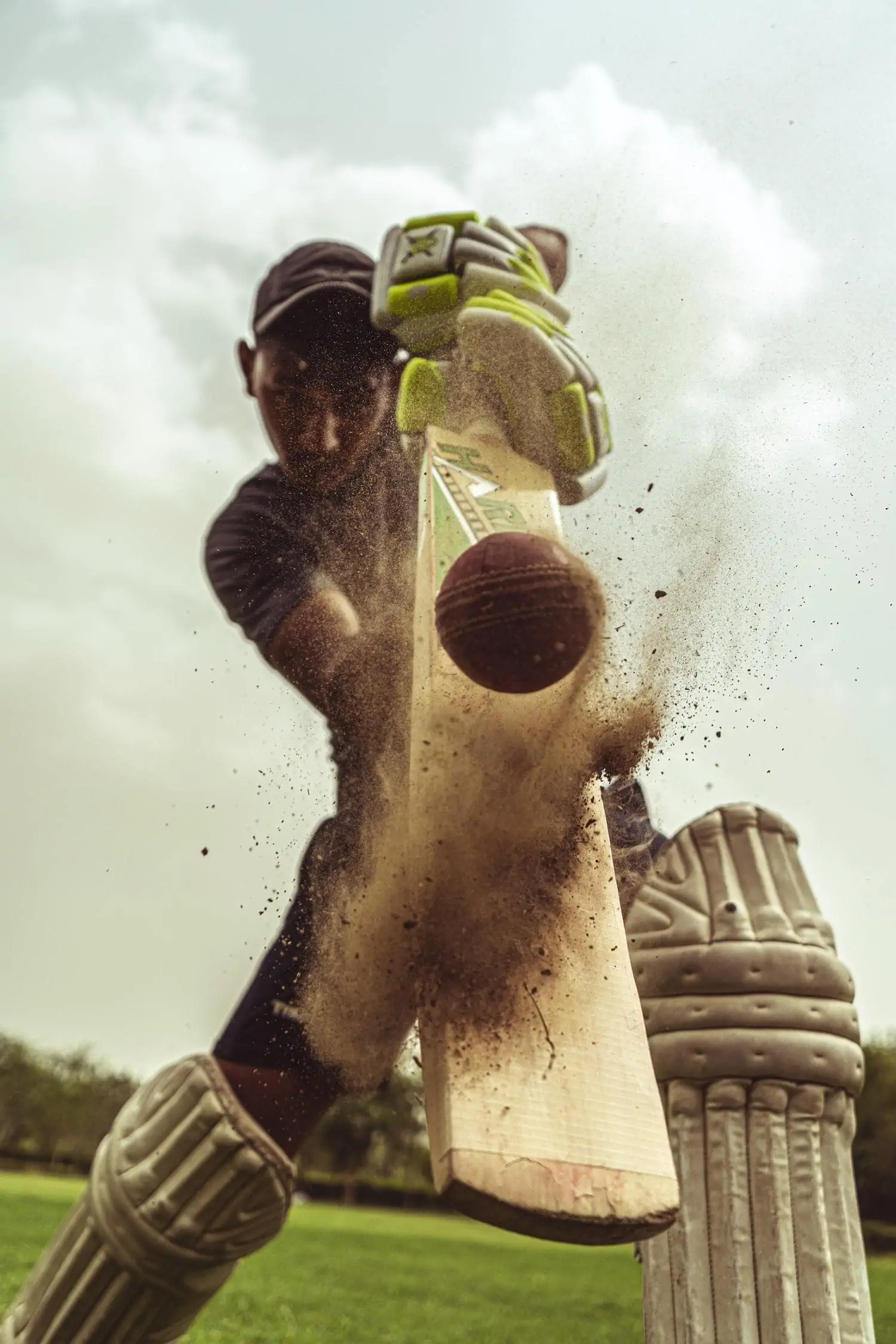 cricket player hitting ball