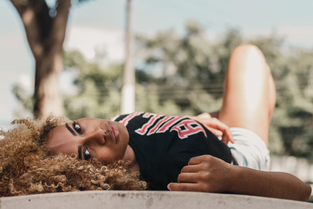 Portrait afro woman lying down