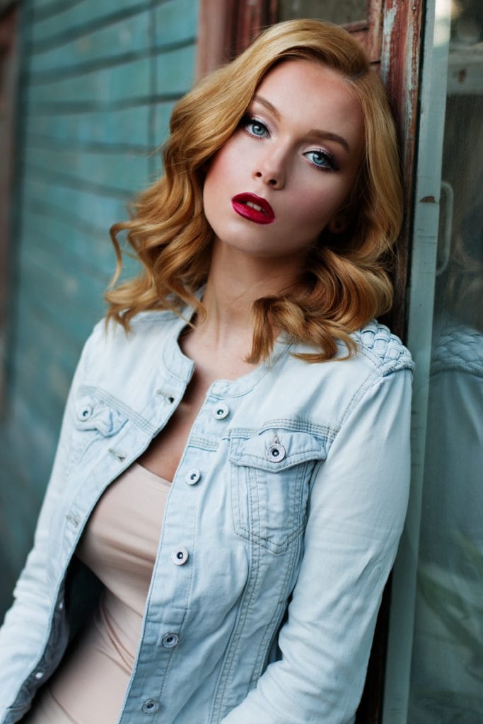 Woman leaning against the wall