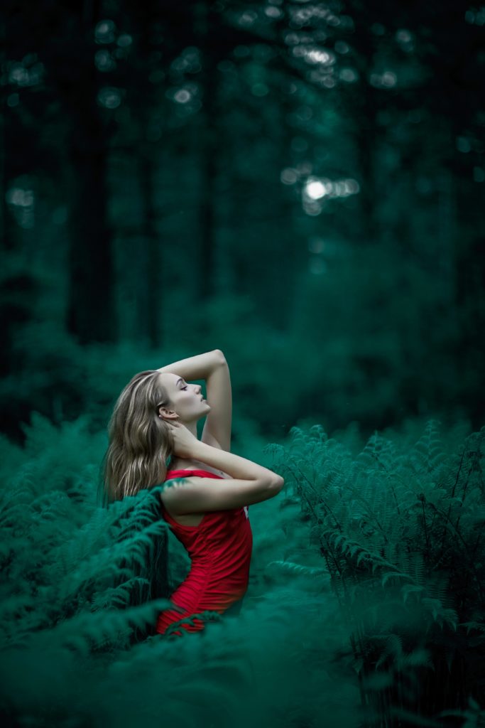 Woman in red posing