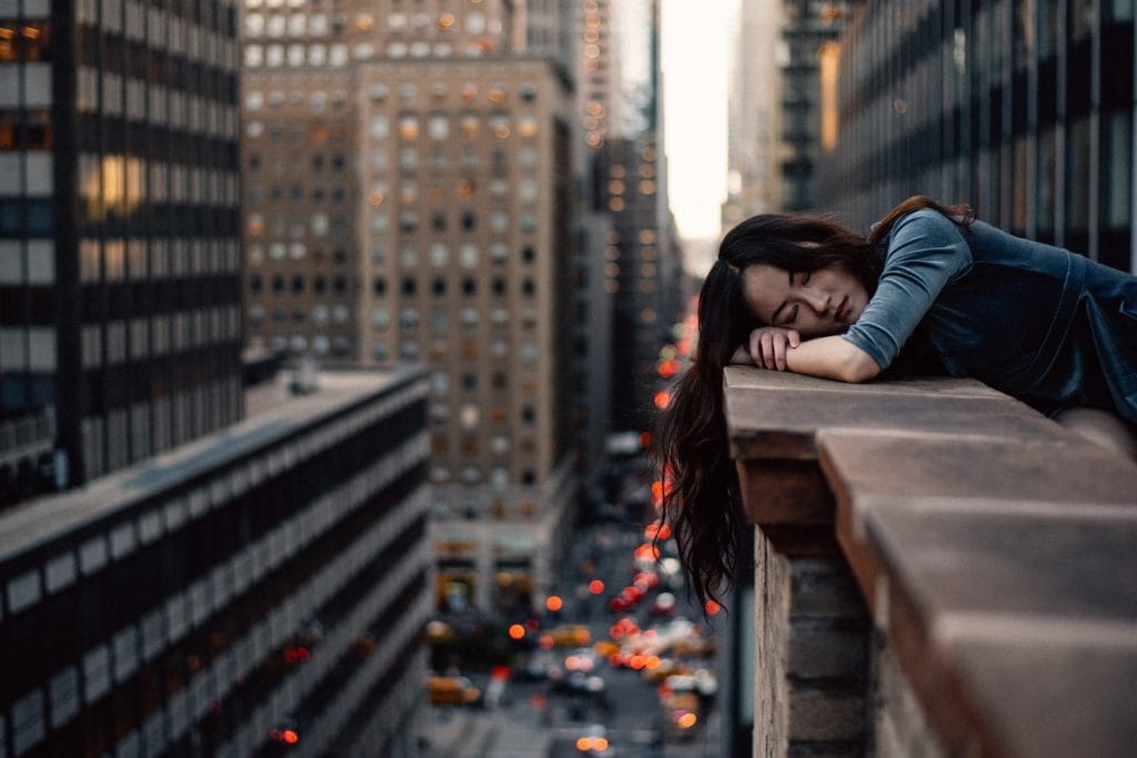 Portrait of girl on tall skyscraper