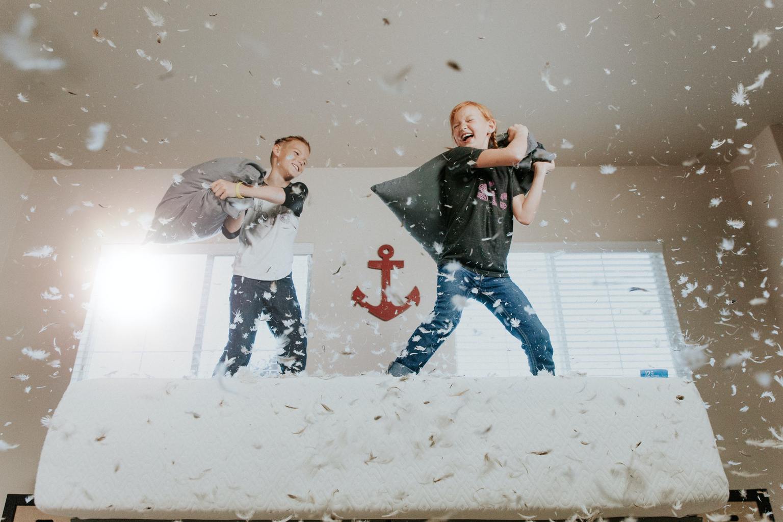 Motion capture photography of children having fun with a pillow fight