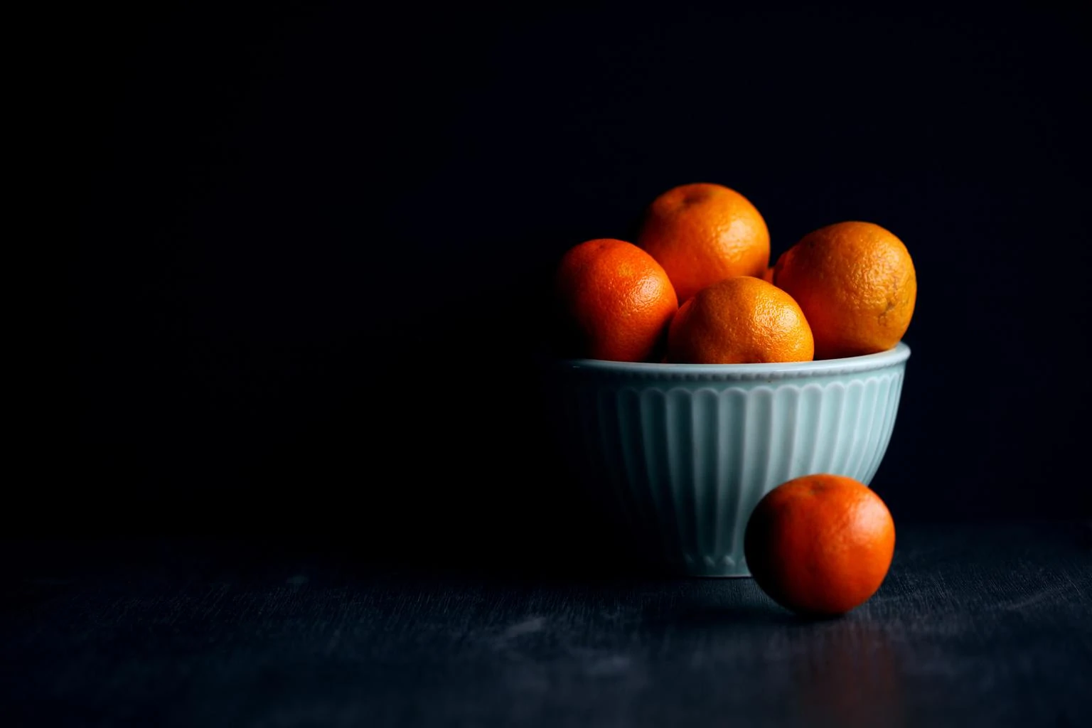 oranges dark background still life