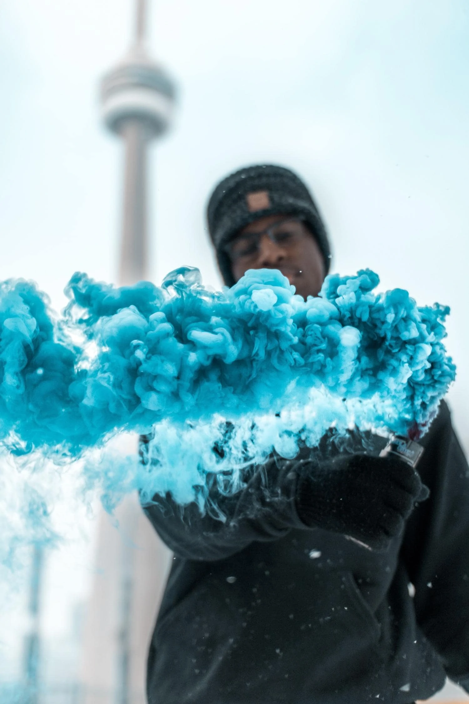 Urban portrait with blue smoke