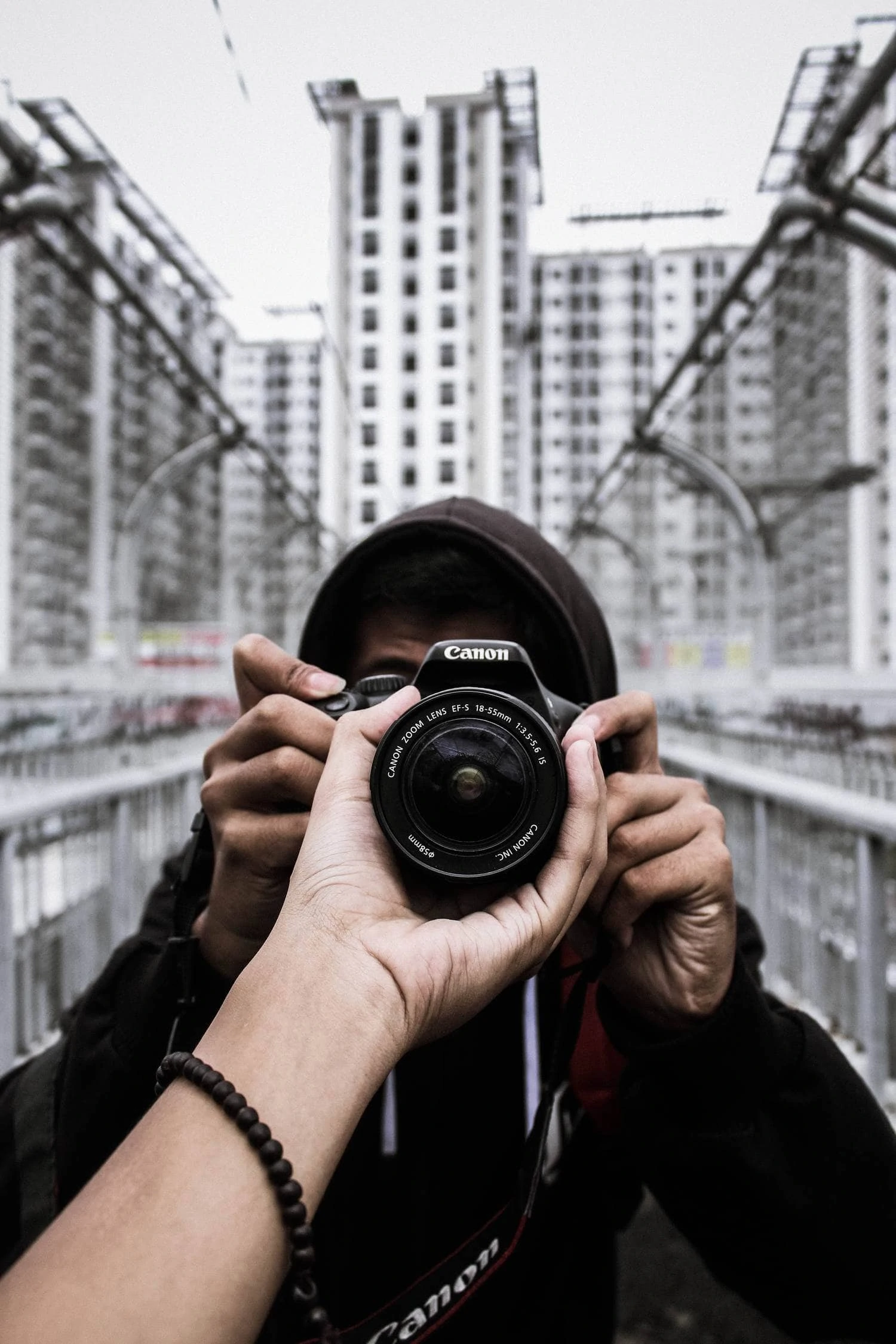 Set of hands with camera and lens