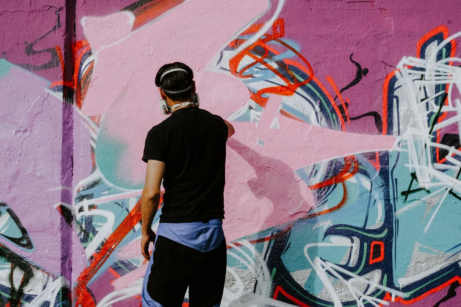 graffiti artist painting wall