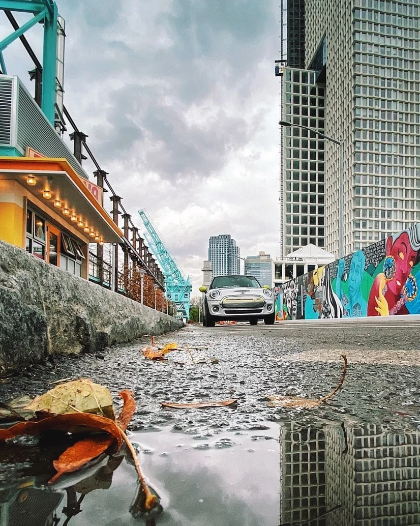 Urban scene with car and reflection