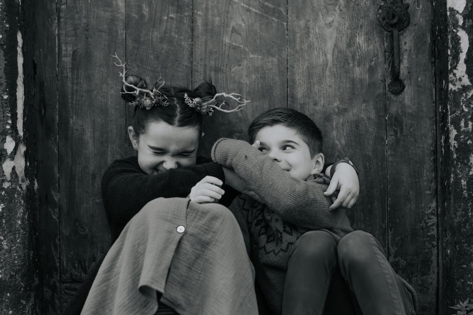 Photograph of two brothers laughing and playing