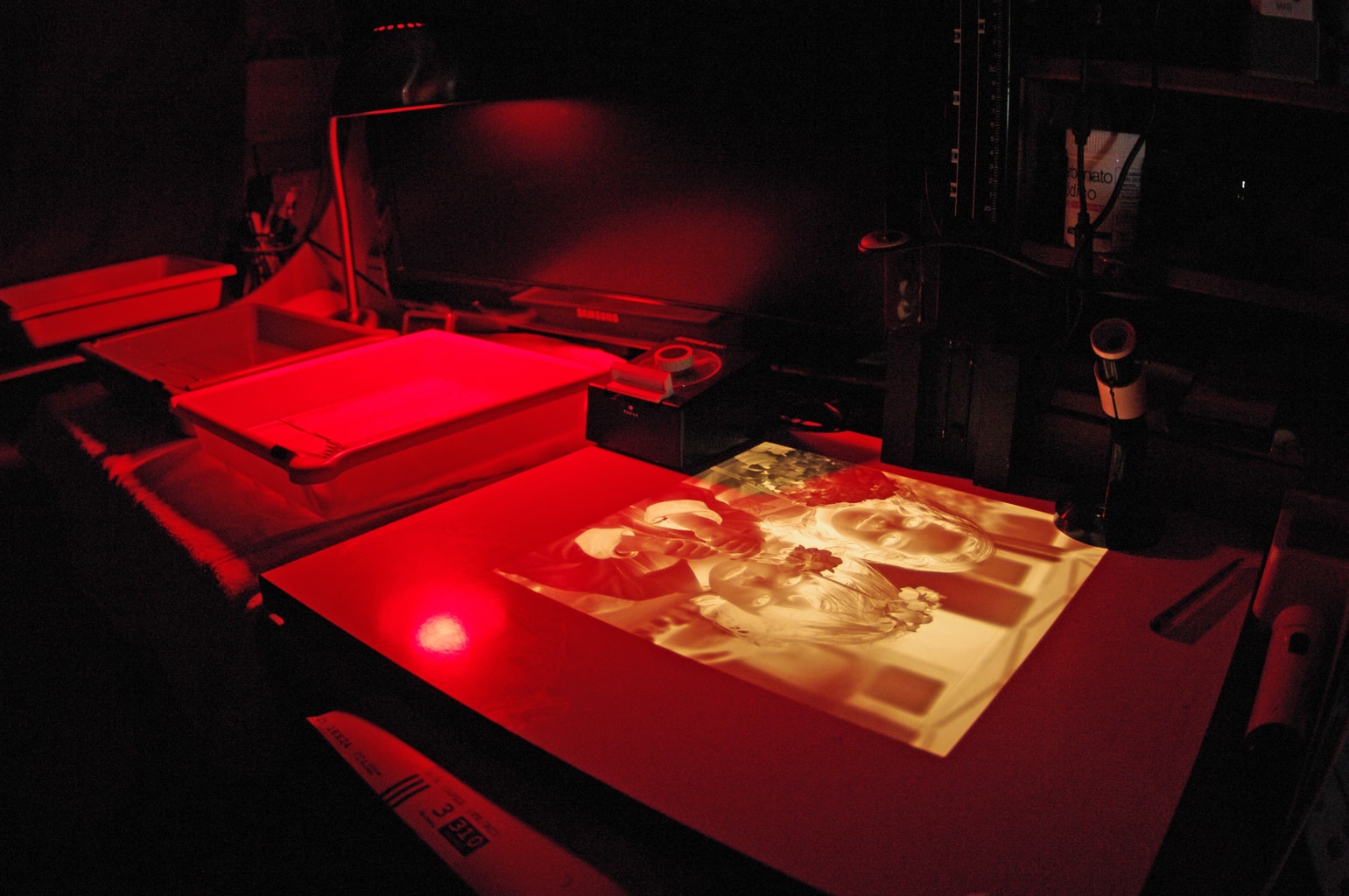 Analogue development in a darkroom with red light