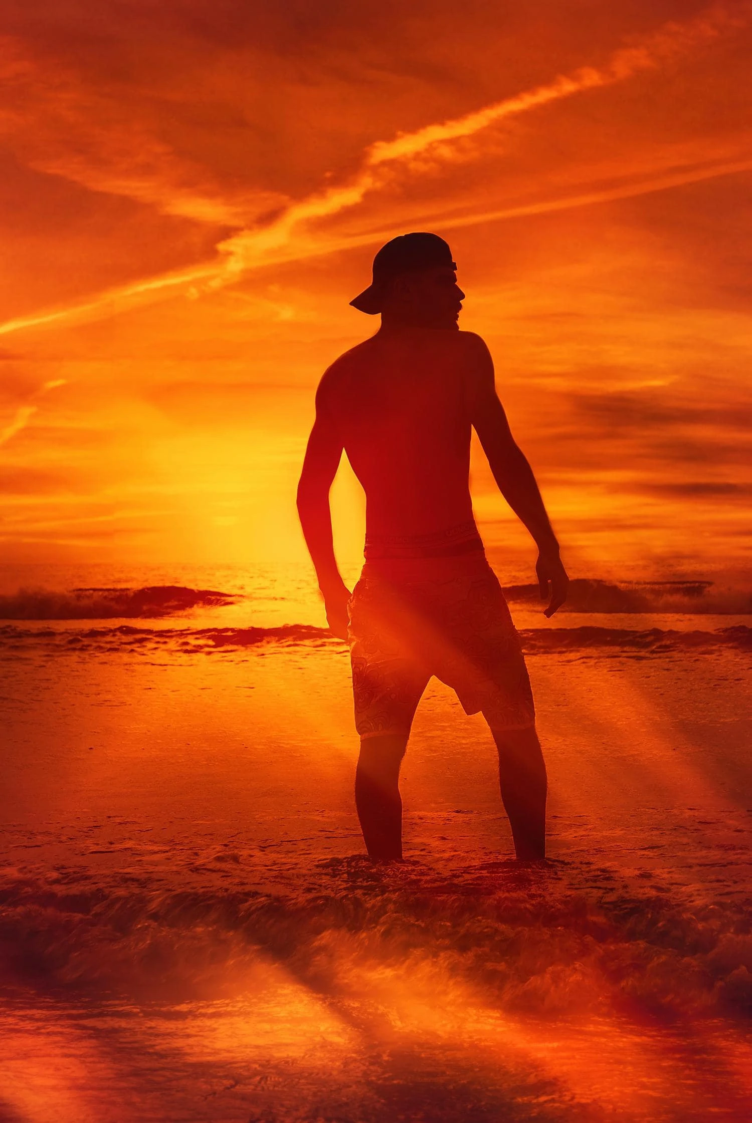 man backlit beach